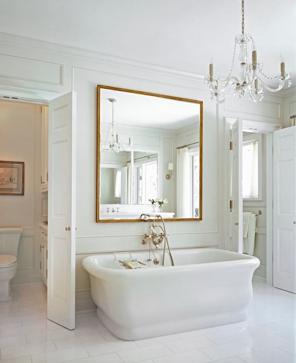 Mirror over bathtub in washroom