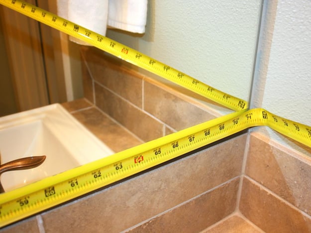 How to Create a DIY Mirror Frame for Your Bathroom - Measure your mirror